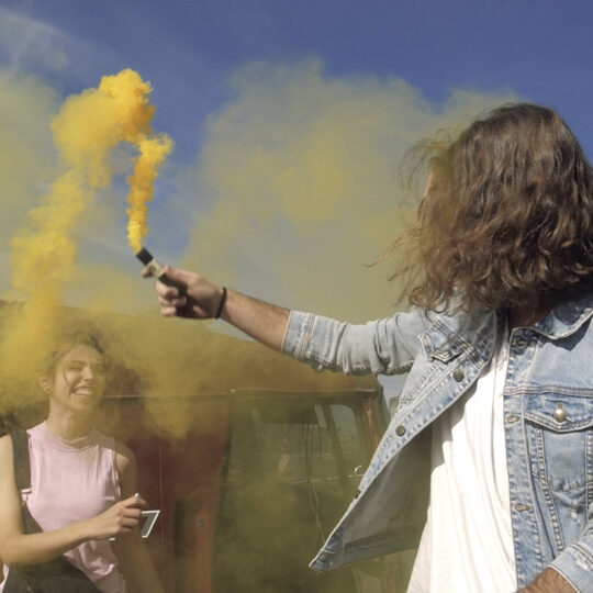 playing-with-a-yellow-smoke-bomb